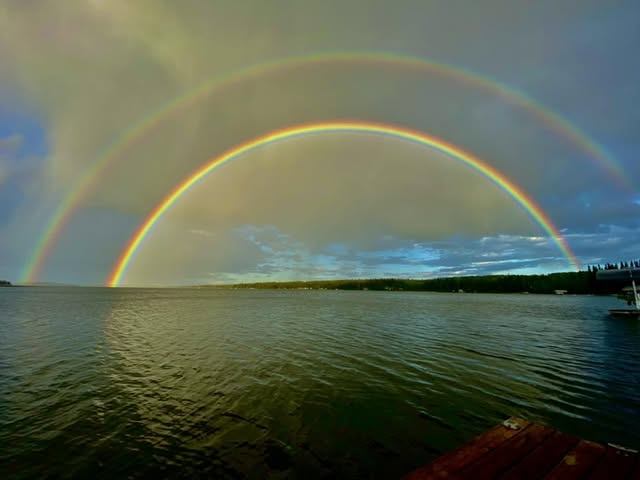 Double rainbow over the water at Crane Lake, Alberta