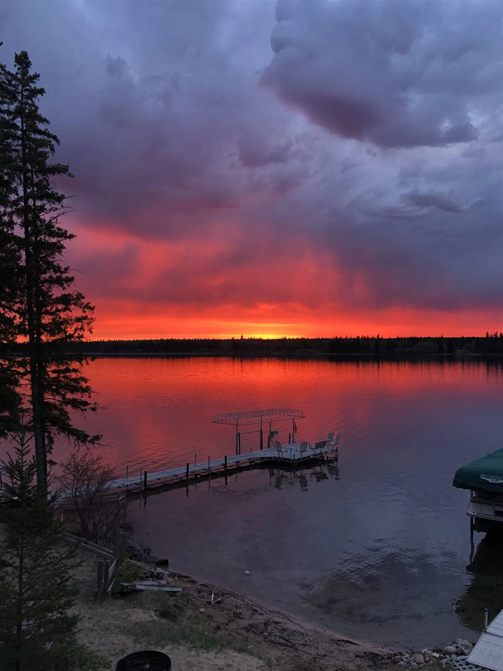 Sunset over Crane Lake, Alberta, from a dock