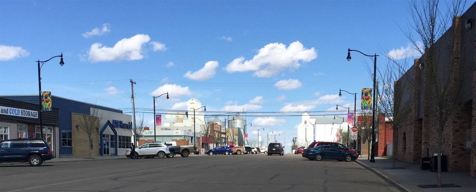 Main Street in Killam, Alberta with grain elevators in the background