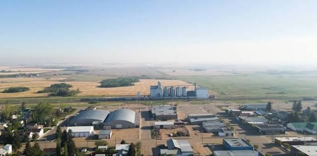 Aerial view of the grain elevator and railway at Killam, Alberta