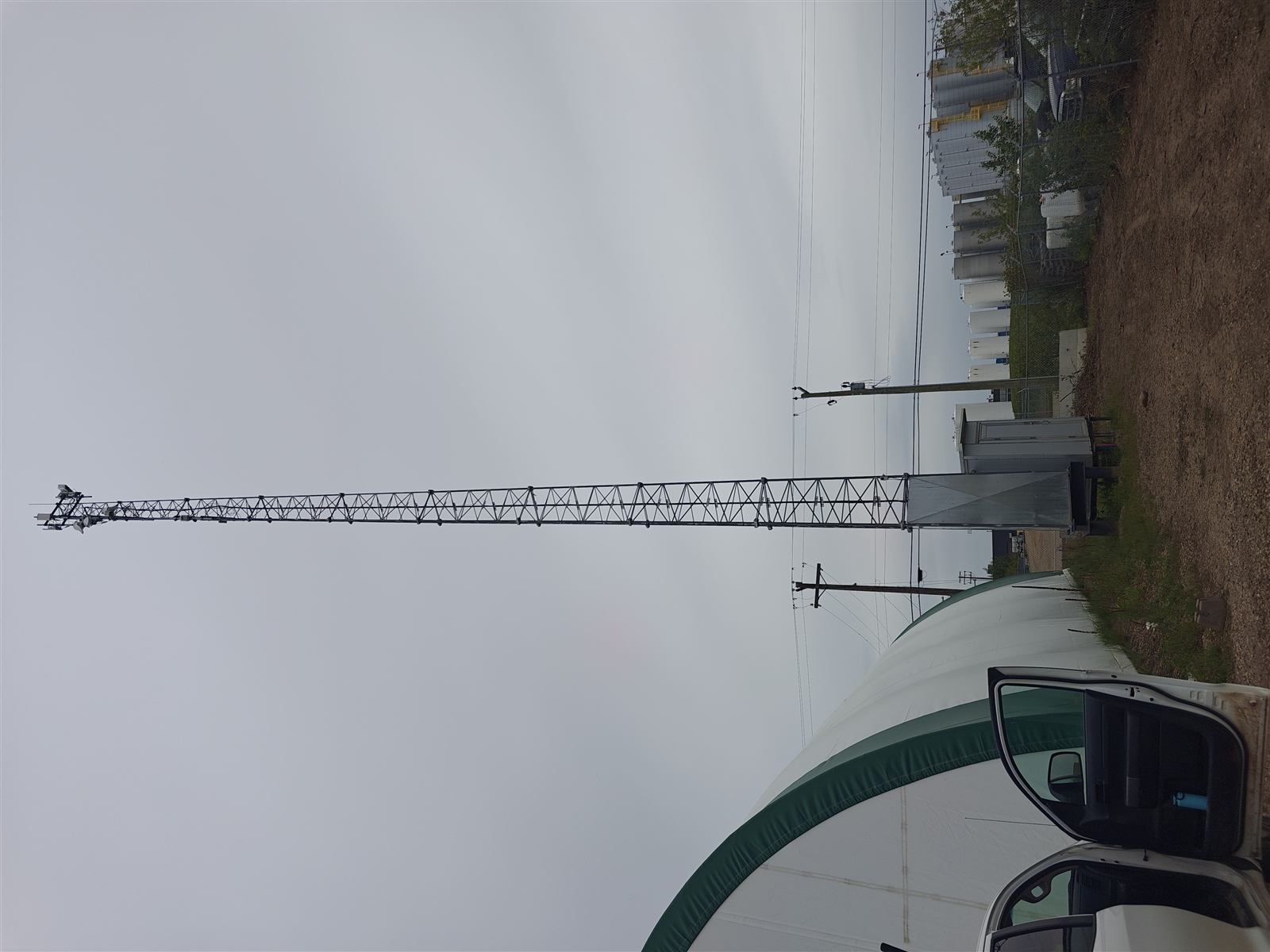 MCSnet communications tower mounted on a warehouse rooftop in the Nisku Industrial Business Park